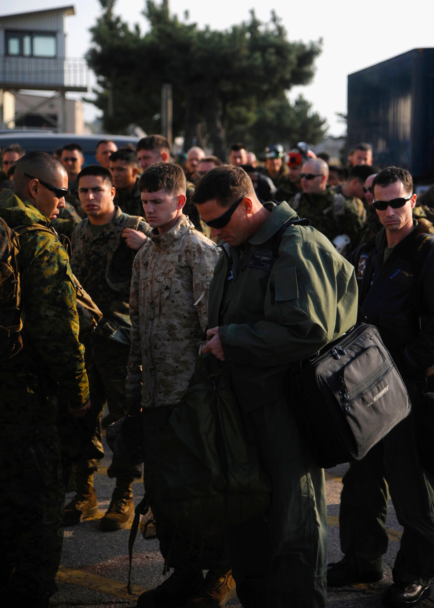 U.S. Marines from Iwakuni Marine Corps Air Station, Japan, arrive at Kunsan Air Base, Republic of Korea, Oct. 24, 2013 as part of exercise Max Thunder 13-2. The purpose of the exercise is to enhance the combat readiness of U.S. and ROK air forces and supporting forces through combined and joint large-force employment training. (U.S. Air Force photo by Staff Sgt. Jessica Haas/Released)