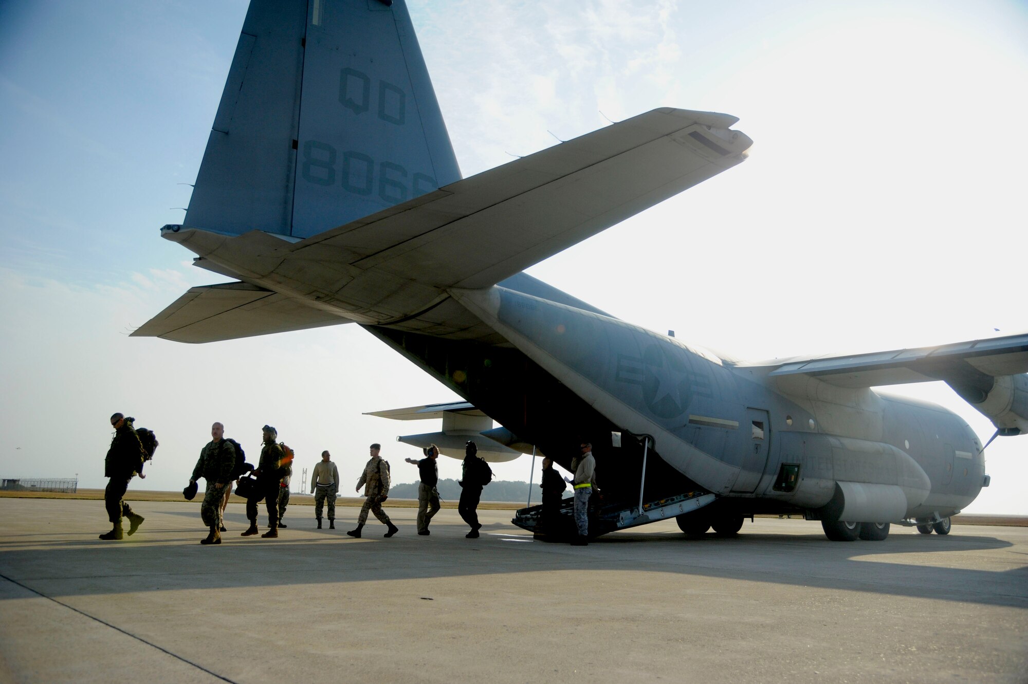 U.S. Marines from Iwakuni Marine Corps Air Station, Japan, arrive at Kunsan Air Base, Republic of Korea, Oct. 24, 2013 as part of exercise Max Thunder 13-2. The purpose of the exercise is to enhance the combat readiness of U.S. and ROK air forces and supporting forces through combined and joint large-force employment training. (U.S. Air Force photo by Staff Sgt. Jessica Haas/Released)