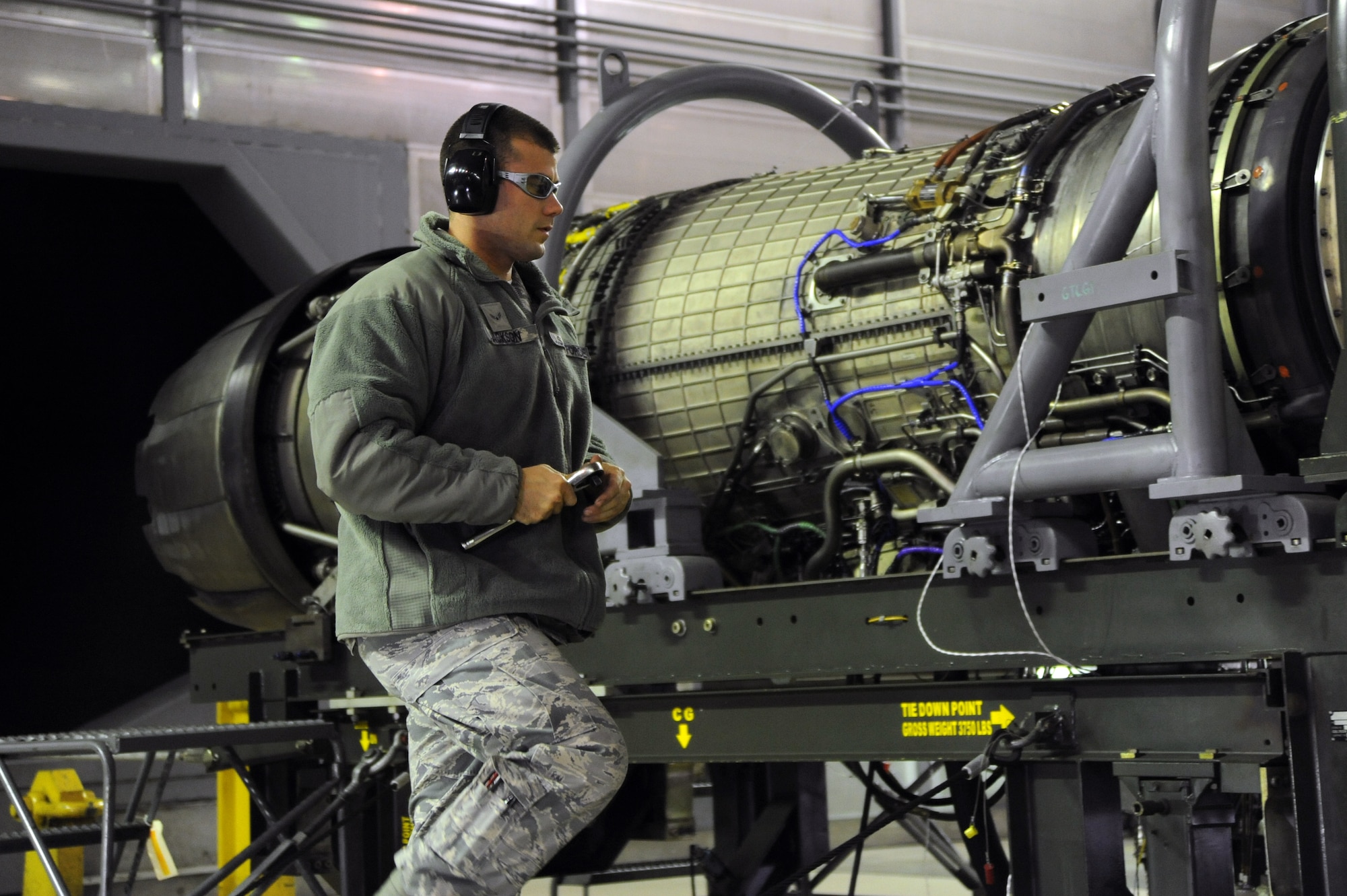 U.S. Air Force Airman 1st Class Matthew Jackson, 35th Maintenance Squadron test cell journeyman, performs pre-test checks on an F110-GE-129 engine used on an F-16 Fighting Falcon at Misawa Air Base, Japan, Oct. 23, 2013. The engine test cell at Misawa AB supports operations across the world, including two U.S. Air Force fighter wings in Korea. (U.S. Air Force photo by Senior Airman Derek VanHorn)