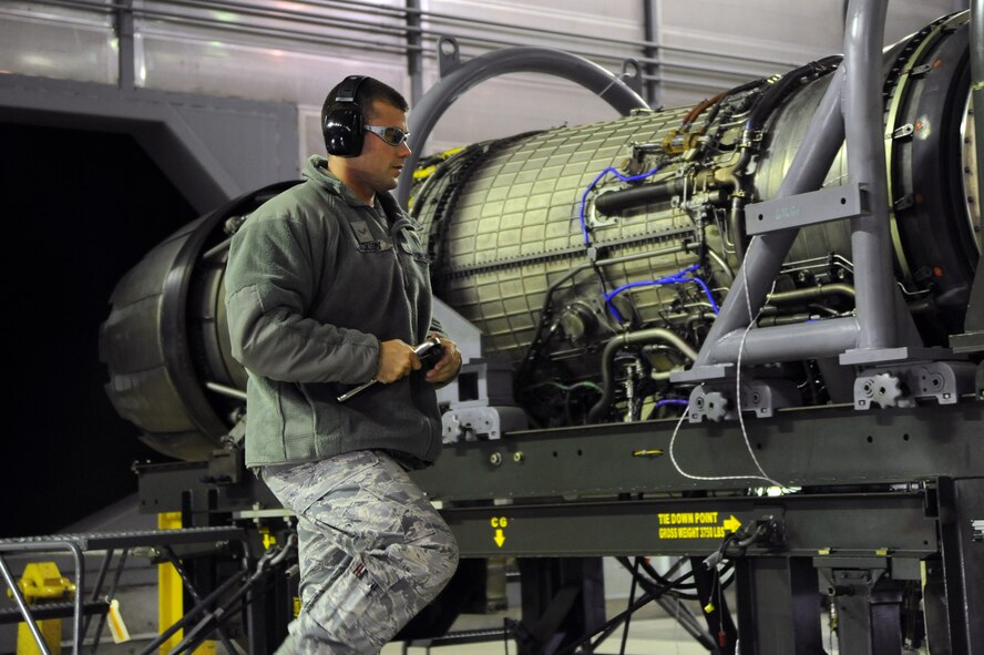 U.S. Air Force Airman 1st Class Matthew Jackson, 35th Maintenance Squadron test cell journeyman, performs pre-test checks on an F110-GE-129 engine used on an F-16 Fighting Falcon at Misawa Air Base, Japan, Oct. 23, 2013. The engine test cell at Misawa AB supports operations across the world, including two U.S. Air Force fighter wings in Korea. (U.S. Air Force photo by Senior Airman Derek VanHorn)