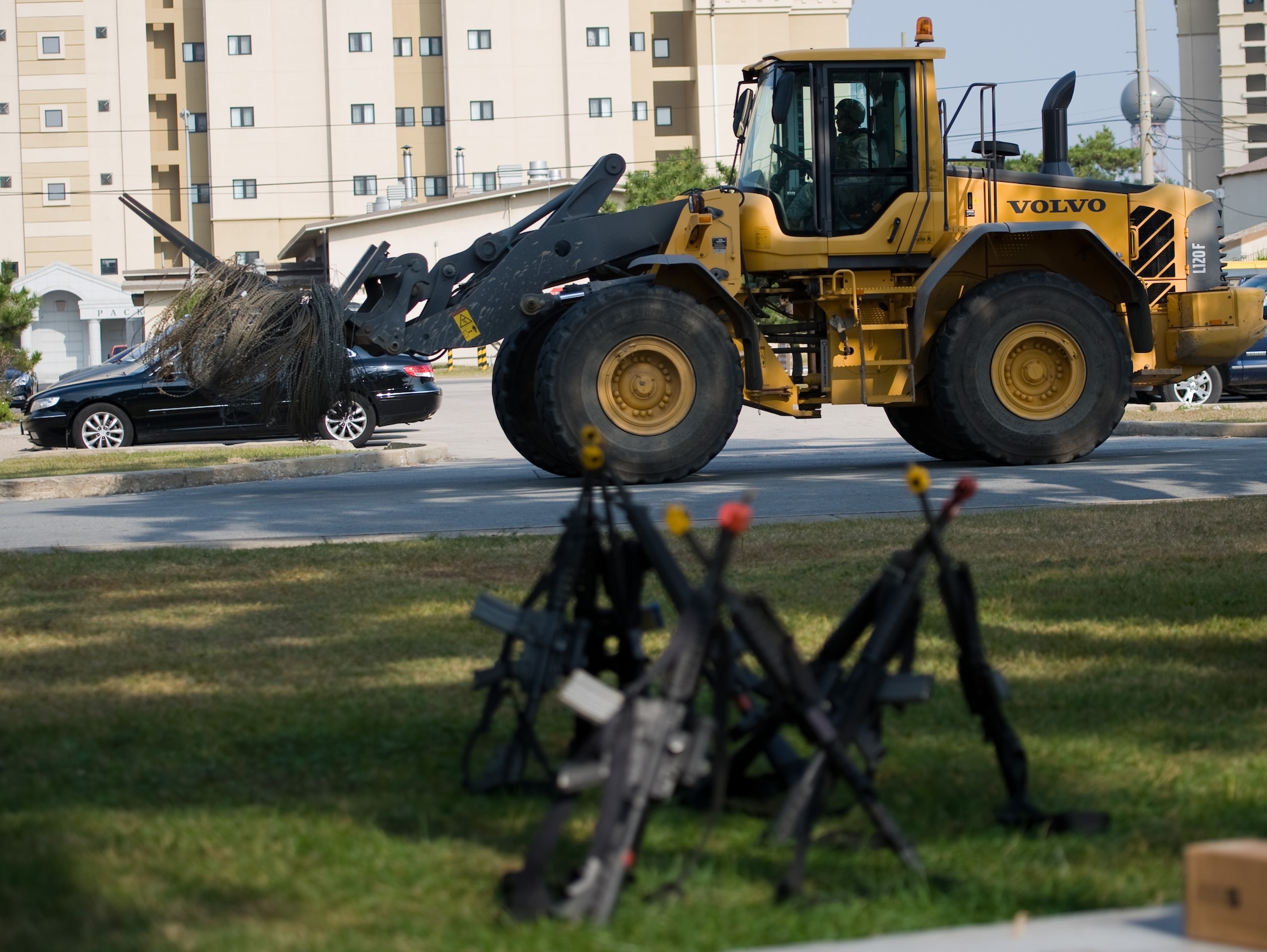 An Airman from the 8th Civil Engineer Squadron delivers concertina wire to a training area at Kunsan Air Base, Republic of Korea, Oct. 24, 2013. Airmen from the 8th CES trained with the 8th Security Forces Squadron on how to defend their compound. The 8th SFS trained the Red Devils on communication tactics, apprehending suspects and manning defensive positions. (U.S. Air Force photo by Senior Airman Armando A. Schwier-Morales/Released)