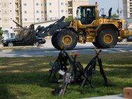 An Airman from the 8th Civil Engineer Squadron delivers concertina wire to a training area at Kunsan Air Base, Republic of Korea, Oct. 24, 2013. Airmen from the 8th CES trained with the 8th Security Forces Squadron on how to defend their compound. The 8th SFS trained the Red Devils on communication tactics, apprehending suspects and manning defensive positions. (U.S. Air Force photo by Senior Airman Armando A. Schwier-Morales/Released)