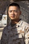 Staff Sgt. NamGary Yuan, a Marine reservist from Las Vegas, Nev., and motor transportation chief with Combat Logistics Regiment 2, Regional Command (Southwest), poses for a photo at Camp Leatherneck, Helmand province, Afghanistan, Oct. 9, 2013. Yuan helps organize and conduct combat logistics patrols throughout Helmand province and serves as an immediate response team leader for downed vehicles in need of recovery.