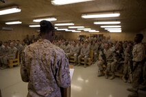 Marines with Combat Logistics Regiment 2, Regional Command (Southwest), sit in the base chapel at Camp Leatherneck, Helmand province, Afghanistan, during the graduation ceremony for the regiment's forward-deployed Corporals Course, Oct. 11, 2013. CLR-2 conducted more than two weeks of leadership training with a class of 39 corporals in spite of the unit's high operational tempo and deployed status.