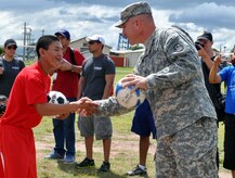 U.S. Army Col. Thomas Boccardi, Joint Task Force-Bravo commander, presents soccer balls to participants of the Honduras Special Olympics soccer tournament at Soto Cano Air Base, Honduras, Oct. 25, 2013.  Boccardi presented the balls as part of "Kick for Nick," a non-profit organization founded in honor of U.S. Army Pvt. Nick Madaras. While serving in Iraq in 2006, Madaras gathered soccer balls to give to underprivileged children near his post. However, he was killed and was never able to distribute the balls himself. Shortly after his death, the "Kick for Nick" organization was established in his honor. Today, soccer balls are donated and distributed to underprivileged children around the world through "Kick for Nick," in memory of Pvt. Madaras. (U.S. Air Force photo by Capt. Zach Anderson)