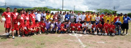 U.S. Army Col. Thomas Boccardi, Joint Task Force-Bravo commander, presented soccer balls to participants of the Honduras Special Olympics soccer tournament at Soto Cano Air Base, Honduras, Oct. 25, 2013.  Boccardi presented the balls as part of "Kick for Nick," a non-profit organization founded in honor of U.S. Army Pvt. Nick Madaras. While serving in Iraq in 2006, Madaras gathered soccer balls to give to underprivileged children near his post. However, he was killed and was never able to distribute the balls himself. Shortly after his death, the "Kick for Nick" organization was established in his honor. Today, soccer balls are donated and distributed to underprivileged children around the world through "Kick for Nick," in memory of Pvt. Madaras. (Photo by Martin Chahin)