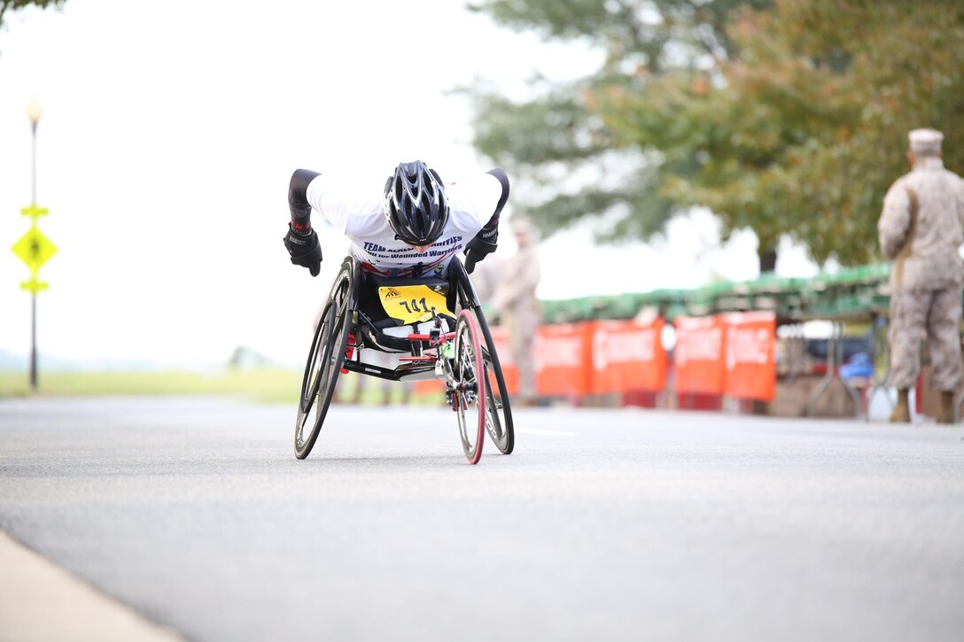 A participant approaches the half-way point of the Marine Corps Marathon in Washington, D.C., on Oct. 27, 2013. More than three dozen Marines and civilian volunteers were there to hand out water and Gatorade.