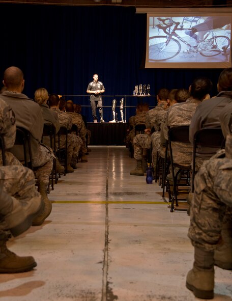 Airmen from the 133rd Airlift Wing gather in the north hangar for the Wingman Day guest speaker in St. Paul, Minn., Oct. 26, 2013.  Mike Schultz a professional snocross rider, owner, and engineer for Bioadapt Inc. speaks to the Airmen about resiliency after life changing events. 
(U.S. Air National Guard Photo by Senior Airman Kari Giles/released.)
