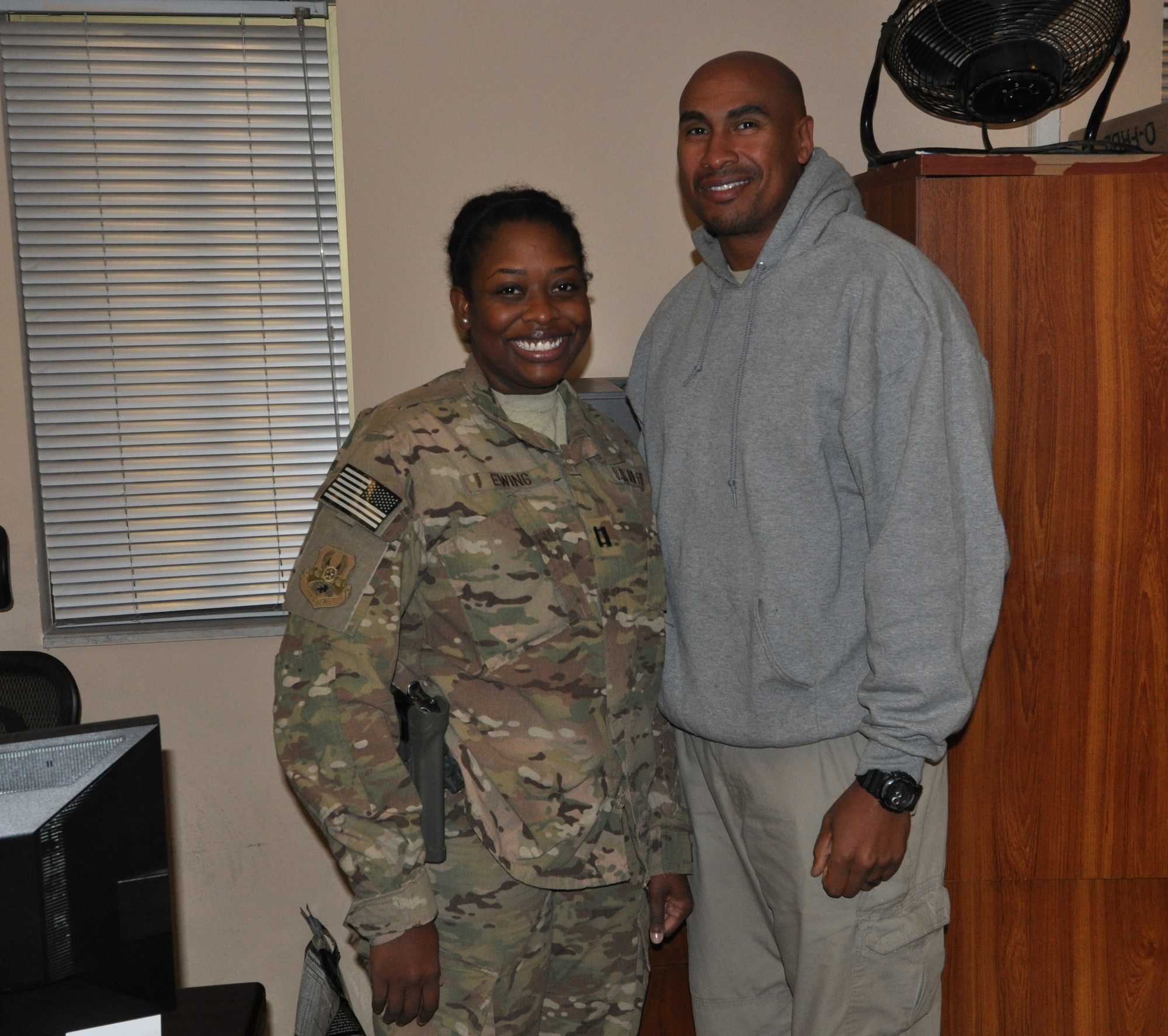 Capt. Tricia Ewing, deputy director, financial management and comptroller for Air Force Central Command Forward Staff, and a native of Canton, Ohio, got the opportunity to reunite with her husband, Reggie, a Sentel Corporations inventory management specialist under the 401st Army Field Support Brigade who hails from Nashville, Tenn. , while they’re in the area of responsibility for a short time during their one-year assignments Oct. 27, 2013 at Bagram Airfield, Afghanistan. (U.S. Air Force photo/Tech. Sgt. Rob Hazelett)