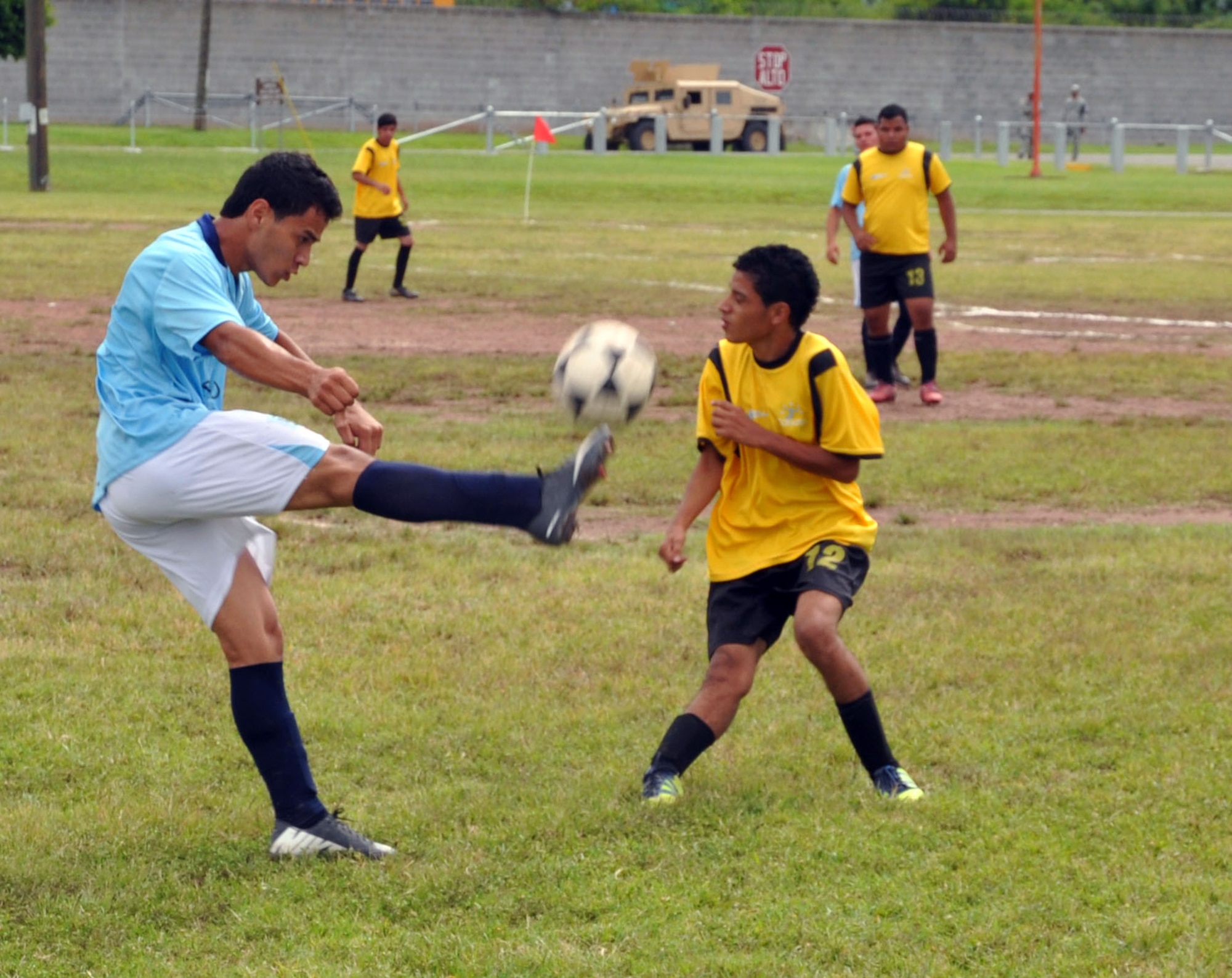 Honduran Special Olympics athletes compete in a soccer match at Soto Cano Air Base, Honduras, Oct. 26, 2013.  Joint Task Force-Bravo partnered with Special Olympics-Honduras and the Honduran Air Force to host the Special Olympics soccer tournament.  (U.S. Air Force photo by Capt. Zach Anderson)