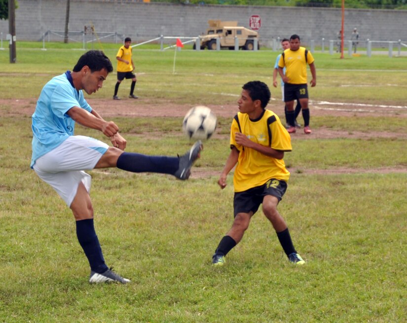 Honduran Special Olympics athletes compete in a soccer match at Soto Cano Air Base, Honduras, Oct. 26, 2013.  Joint Task Force-Bravo partnered with Special Olympics-Honduras and the Honduran Air Force to host the Special Olympics soccer tournament.  (U.S. Air Force photo by Capt. Zach Anderson)