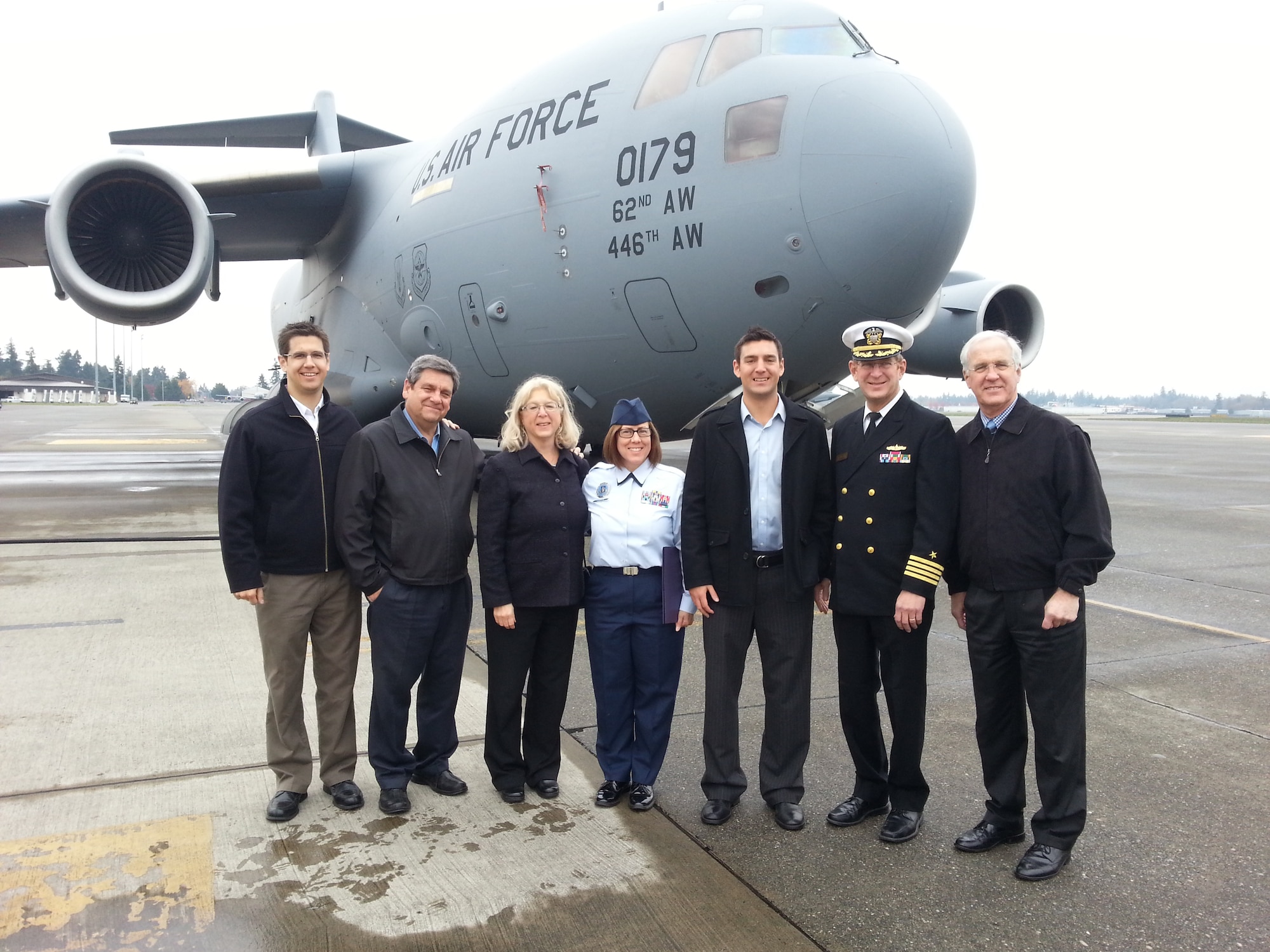 Joshua Brewer, a Boeing engineer, was sworn in Oct. 25 on the flight line at McChord Field, Wash., by his uncle, a retired Navy Reservist, as the newest pilot in the 313th Airlift Squadron. His family and members of the 313th attended the event, which was held in front of the C-17 Globemaster III that Brewer will fly after graduating from Officer 
Candidate School and pilot training. His training will take about a year to complete.(U.S. Air Force Reserve photo by Lt. Col. Anna Sullivan)
