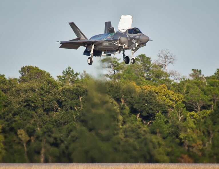 A Marine F-35B joint strike fighter hovers over the runway during the first short take-off and vertical landing mission at Eglin Air Force Base, Fla., Oct. 25. The milestone training mission was flown by Maj. Brendan M. Walsh, of the Marine Fighter Attack Training Squadron-501.  Walsh recently qualified in vertical landing operations at Marine Corps Air Station Yuma, Ariz. in preparation for this mission.  (U.S. Air Force photo/Samuel King Jr.)