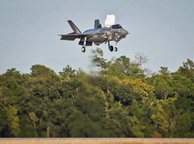 A Marine F-35B joint strike fighter hovers over the runway during the first short take-off and vertical landing mission at Eglin Air Force Base, Fla., Oct. 25. The milestone training mission was flown by Maj. Brendan M. Walsh, of the Marine Fighter Attack Training Squadron-501.  Walsh recently qualified in vertical landing operations at Marine Corps Air Station Yuma, Ariz. in preparation for this mission.  (U.S. Air Force photo/Samuel King Jr.)