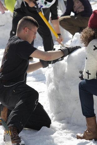 Combat Logistics Company 36 Marines place the roof on their igloo during the First World Igloo Building Championship competition, which took place at the Osorakan Snow Park, located in the town of Akiota, Feb. 3, 2013. Teams were limited to a maximum of six participants. 


