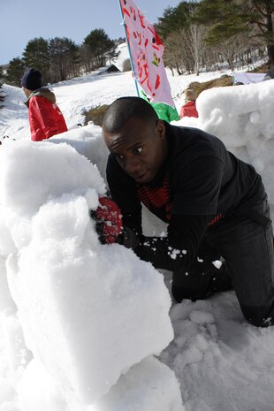 Lance Cpl. Markeith Allencampbell, First World Igloo Building Championship competitor, works on his team's igloo during the event, which took place at the Osorakan Snow Park, located in the town of Akiota, Feb. 3, 2013. Forty three teams, comprised of participants from eight different countries, competed in the igloo building.