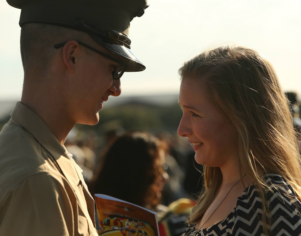 A new Marine of India Company, 3rd Recruit Training Battalion, greets his family following his graduation ceremony Oct. 25, 2013, on Parris Island, S.C. The Marines spent nearly 13 weeks away from home training to earn their places in the Corps. (Photo by Cpl. Caitlin Brink)