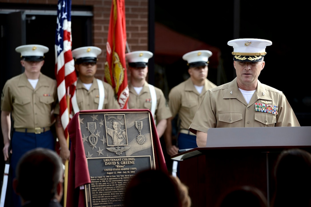 Col. Robert T. Tobin, Marine Aircraft Group-49 commander, speaks during a hangar dedication ceremony held at Joint Base McGuire-Dix-Lakehurst Oct. 19. MAG-49 dedicated two hangars in honor of Lt. Cols. David S. Greene and Franklin P. Kolbe Jr. who both died in service to their country. (U.S. Air Force photo/Staff Sgt. Katherine Tereyama)