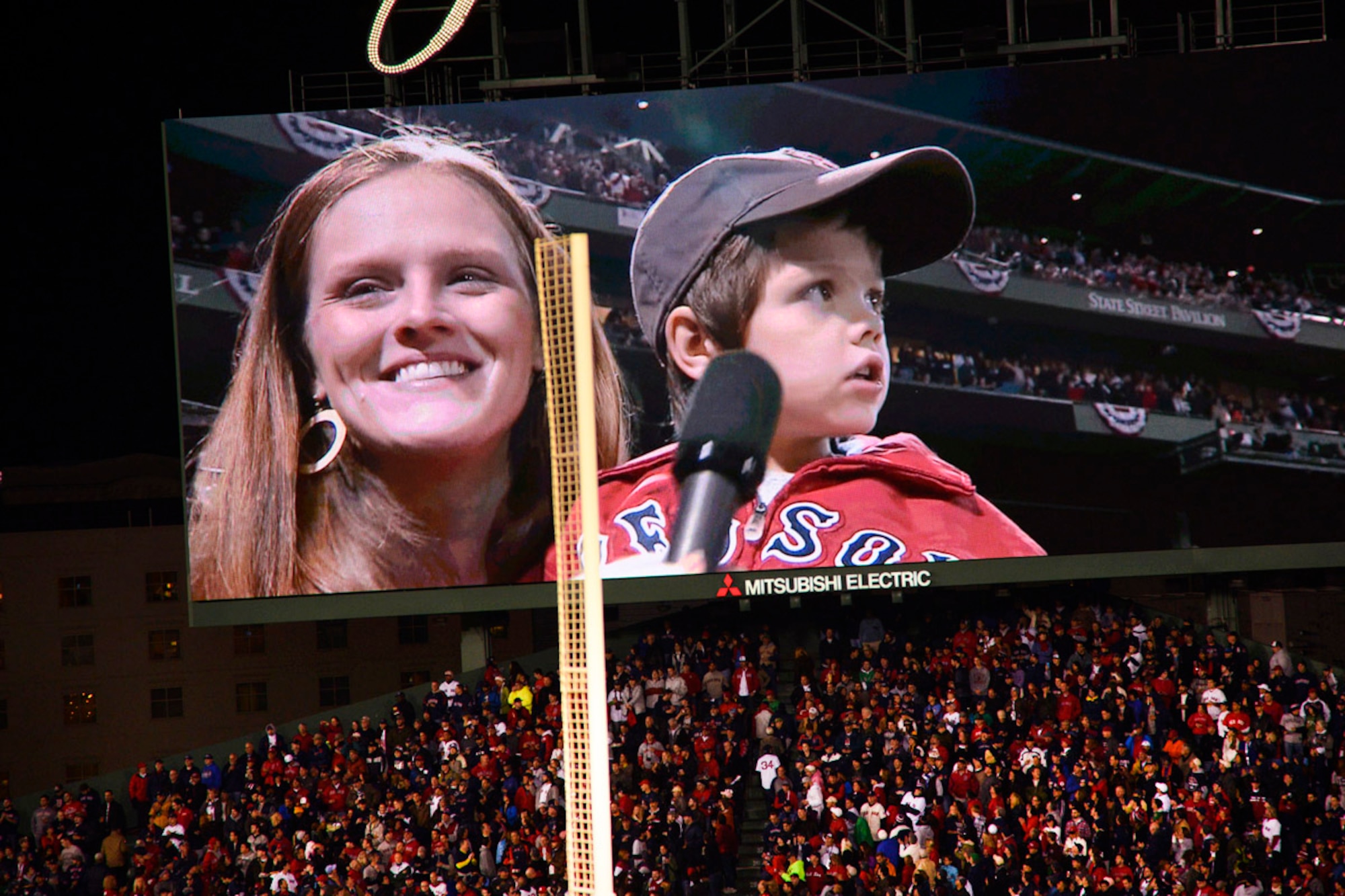 Lindsey Miller holds her 5-year old son Jacoby moments before he declared, "Play Ball" during the pregame ceremony at the start of the 2013 World Series Oct. 23, 2013 at Fenway Park. Jacoby was selected to make the ceremonial call based on his father, Capt. Garrett Miller, being deployed from Hanscom Air Force Base to an overseas location. 