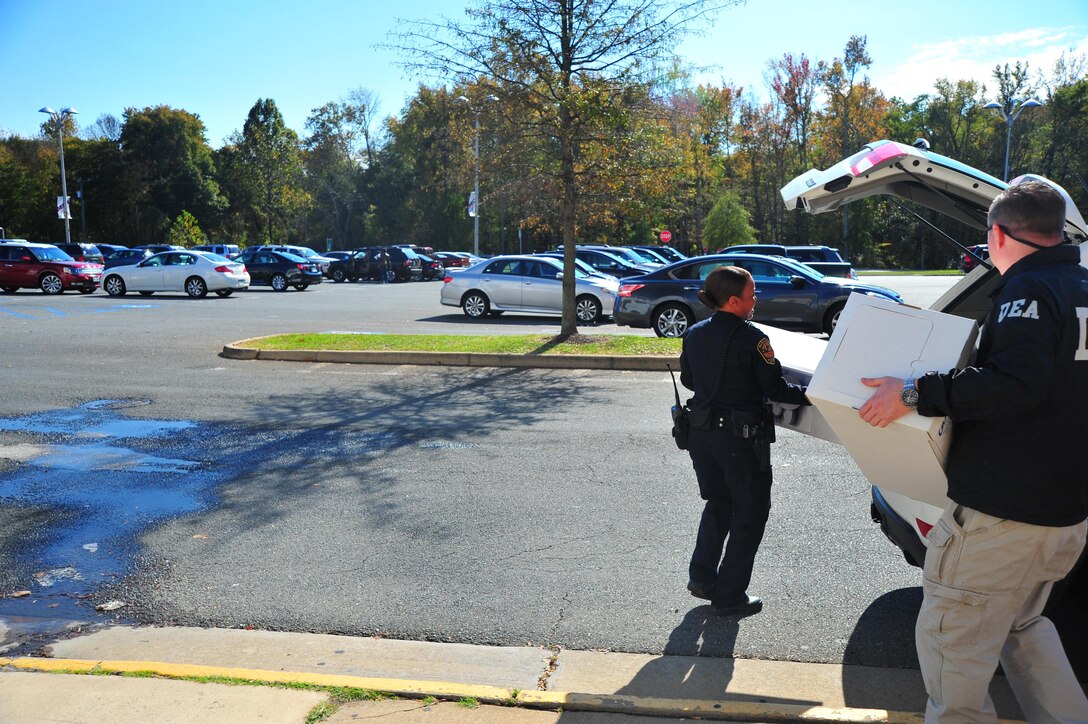 Brandi Salvant, officer, Provost Marshal Office, secures the drugs collected after the “National Drug Take Back Initiative” on Oct. 23, 2013. The Take Back lasted three hours and Security Battalion collected 70 pounds of drugs.