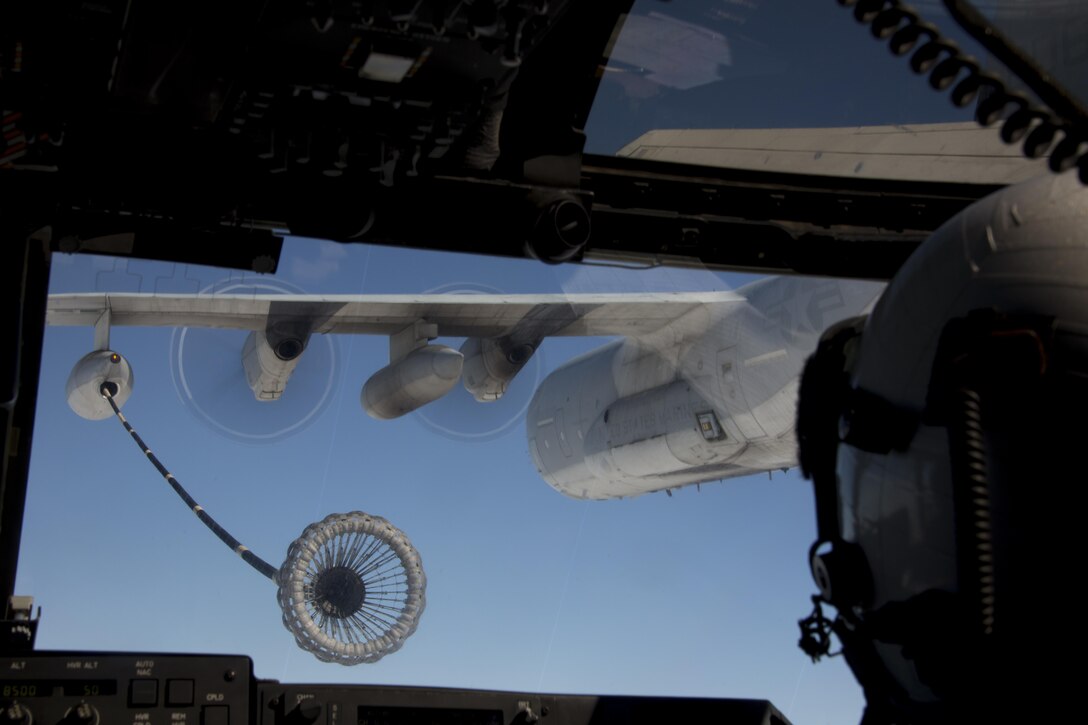 A pilot with Marine Medium Tiltrotor Squadron 161 aims to connect to a KC-130J Super Hercules to receive fuel in flight aboard Marine Corps Air Station Miramar, Calif., Oct. 24. The pilots used this training to remain qualified in aerial refueling.