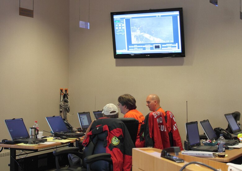 Air Force Reserve Tech. Sgt. David Hodge (right) works with other amatuer radio operators to coordinate resources and monitor for radio support during an annual Salute to American Veterans motorcycle rally in Cripple Creek, Colo. Hodge uses his amateur radio skills to support emergency responders during times of emergencies, to include the Teller County Search and Rescue.  Hodge is the 6th Space Operations Squadron Non-Commissioned Officer in Charge of standardization and evaluation. 