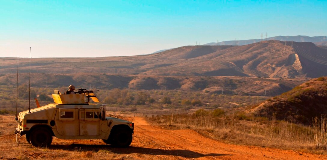 Marines with 1st Air Naval Gunfire Liaison Company in a convoy of five Humvees communicate with two pilots to locate a downed pilot during a tactical rescue of aircraft and personnel exercise aboard Camp Pendleton, Calif., Oct. 21.