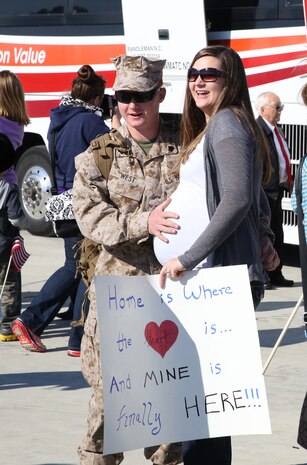 Sgt. Chaz D. West, and Explosives Ordnance Disposal technician with 2nd EOD Company, 8th Engineer Support Battalion, 2nd Marine Logistics Group reunites with family after a seven-month deployment during a homecoming event for 2nd EOD Co. aboard Camp Lejeune, N.C., Oct. 26, 2013. While many were merely reuniting with family, some were meeting new family for the first time and others returned home in time for their children’s first moments. 