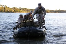 Sgt. Brandon L. Patrick, a Nashville, Tenn., native, and Platoon Sergeant for Improved Ribbon Bridge platoon,  8th Engineer Support Battalion, 2nd Marine Logistics Group, prepares to step onto Wells Point after rafting across French Creek during a field exercise aboard Camp Lejeune, N.C., Oct. 24, 2013. IRB Plt. conducted day and night land navigation training during their two day FEX.