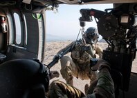 Sgt. Brandon Coburn is hoisted back into a UH-60 Black Hawk helicopter during a training exercise near Forward Operating Base Fenty, Nangarhar Province, Afghanistan, Sept. 16, 2013.