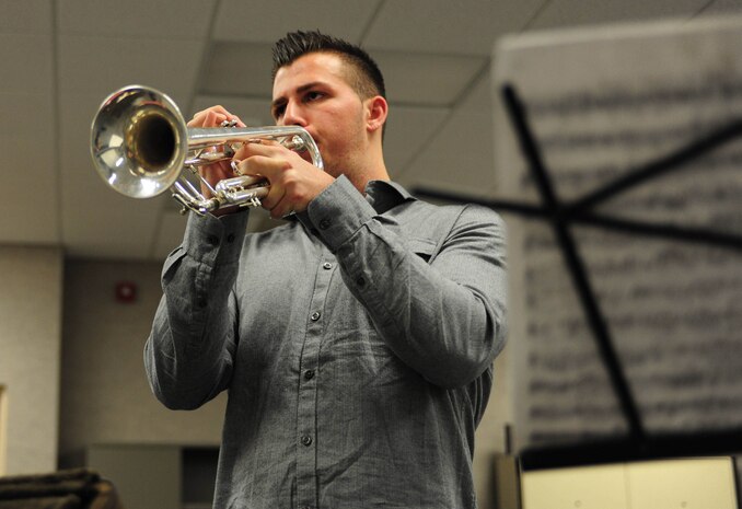 Daniel A. O' Brien, a 2013 graduate of Waynesville High School, Fort Leonard Wood, Mo., warms up on his trumpet before auditioning Oct. 25 for a Musician Enlistment Option Program spot in the United States Marine Corps Band. O'Brien passed the audition and according to his recruiter, Sgt. Jeff A. Haertling, from RSS Ozarks, RS Kansas City, is scheduled ship to boot camp in January. (Photo by Lance Cpl. Bradley Carrier)