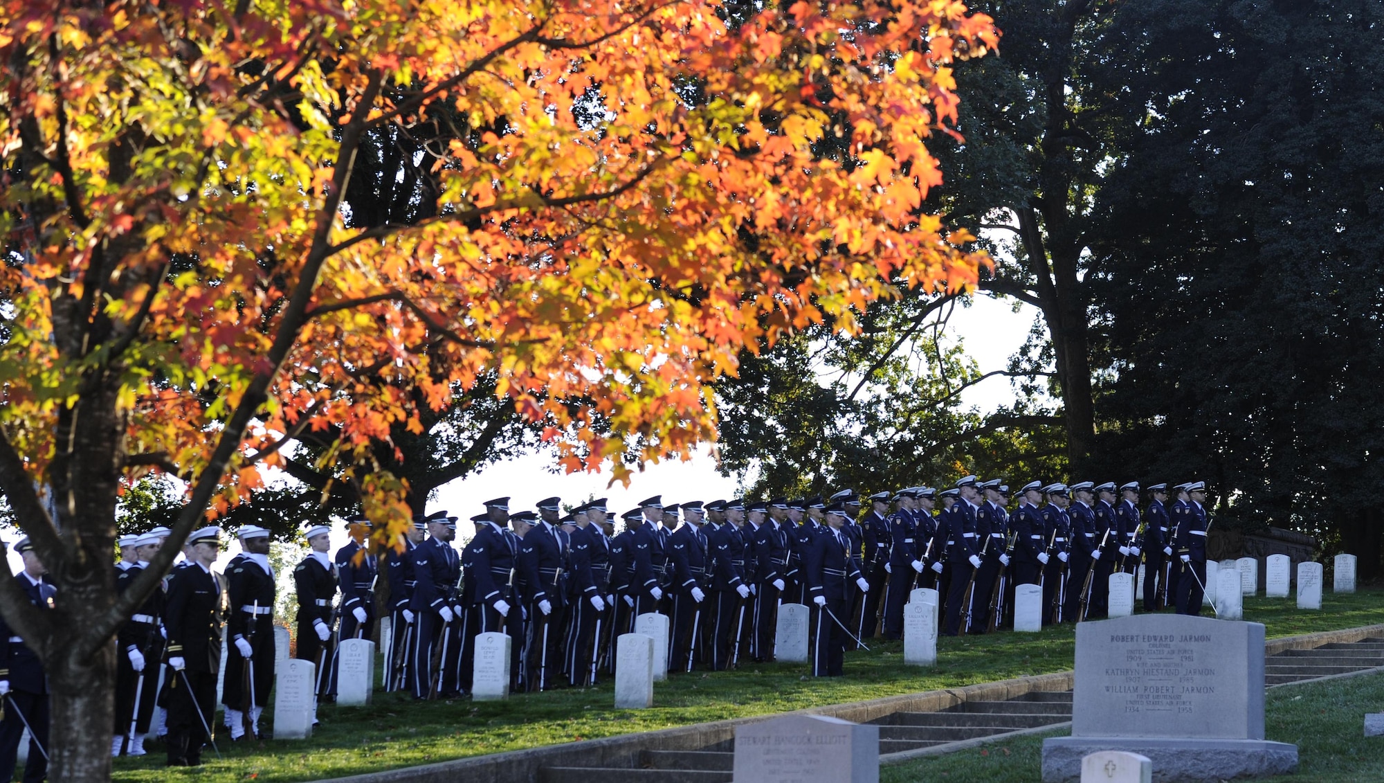 The United States Air Force and Navy Honor Guard Drill Team pay tribute to retired Gen. David C. Jones as he’s laid to rest Oct. 25, 2013, at Arlington National Cemetery, Va. Jones served four years as Air Force chief of staff from 1974 to 1978 until he was appointed as chairman of the Joint Chiefs of Staff, June 21, 1978. As chairman he served as the senior military adviser to the president, the National Security Council and the secretary of Defense.  During the Korean War, Jones was assigned to a bombardment squadron where he accumulated more than 300 flight hours on missions over North Korea. 