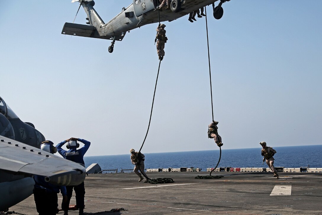 U.S. Marines with Battalion Landing Team 1/4 (BLT), 13th Marine Expeditionary Unit (MEU) conduct fast rope training aboard USS Boxer (LHD 4) Oct. 27, 2013. 13th MEU is deployed with the Boxer Amphibious Ready Group as a theater reserve and crisis response force throughout the U.S. 5th Fleet area of responsibility.(U.S. Marine Corps photo by Lance Cpl. Lonzo-Grei D. Thornton, 13th Marine Expeditionary Unit Combat Camera/Released)