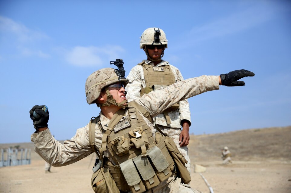 Lance Cpl. Luis Maganapetrana, crewman, Alpha Company, 1st Light Armored Reconnaissance Battalion, and a native of Merced, Calif., throws a practice M67 fragmentation grenade during a live-fire exercise on Range 210F here, Oct. 23, 2013. The Marines fired light anti-armor weapons, M203 grenade launchers and threw live grenades. The exercise is designed to train and evaluate Marines on weapons proficiencies to prepare them for team and squad level live-fire training.