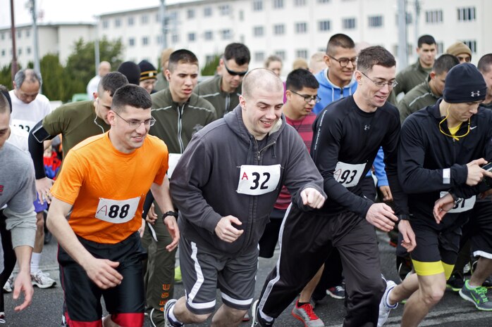 Station residents begin running during the Gokukan two and a half kilometer Fun Run, which took place on the seawall behind the IronWorks Gym here, Feb. 15, 2013. Participant categories for the race included men's, women's and strollers. The run, which takes place here annually and always during February, ensuring the coldest temperature, gets the name Gokkan from the word gokukan, which literally translates to “extreme cold.”