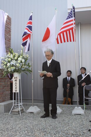 Shimada Yoshikuni, a minister from the Onomichi Yoshiwa Dendosho branch of the United Church of Christ in Japan, recites a prayer during a memorial for POWs from Mukaishima POW Sub-Camp No. 4 in Onomichi, Japan, April 15, 2013. The location was once the sight of the camp. “It is important for us to continue to remember the men and women from all nations who fought in the great conflict,” said Col. James C. Stewart, Marine Corps Air Station Iwakuni commanding officer. “This memorial will stand as a reminder of their tremendous sacrifice and our desire for world peace. Today, Japan and the United States and the United Kingdom form the strongest and most important security alliance in the world.”