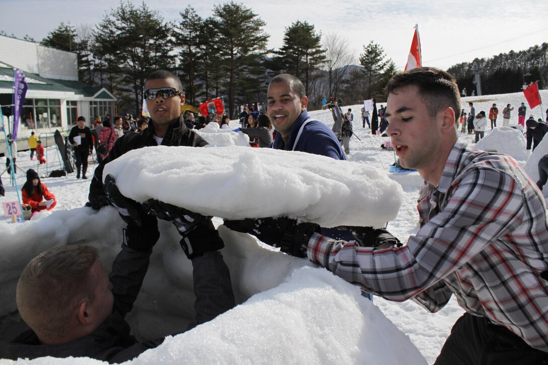 Combat Logistics Company 36 Marines place the roof on their igloo during the First World Igloo Building Championship competition, which took place at the Osorakan Snow Park, located in the town of Akiota, Feb. 3, 2013. Teams were limited to a maximum of six participants.