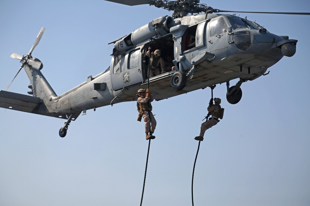 U.S. Marines with Battalion Landing Team 1/4 (BLT), 13th Marine Expeditionary Unit (MEU) conduct fast rope training aboard USS Boxer (LHD 4) Oct. 27, 2013. 13th MEU is deployed with the Boxer Amphibious Ready Group as a theater reserve and crisis response force throughout the U.S. 5th Fleet area of responsibility.(U.S. Marine Corps photo by Lance Cpl. Lonzo-Grei D. Thornton, 13th Marine Expeditionary Unit Combat Camera/Released)