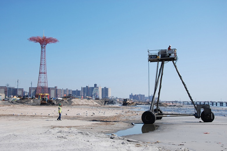 Crews work to place sand and restore the beach at Coney Island Friday September 20, 2013. The U.S. Army Corps of Engineers is placing roughly 600,000 cubic yards of sand at Coney Island to replace sand lost during Hurricane Sandy and also to restore the Coney Island project to its original design profile from when the coastal storm risk reduction project (primarily the beach) was originally constructed in the 1990s. While the beach is a tremendous recreational asset, it's important to note that the engineered beach is designed to act as a buffer and reduce risks to the community from coastal storms like Hurricane Sandy. 