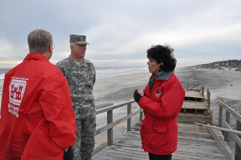 Col. Paul E. Owen, commander of the New York District of the U.S. Army Corps of Engineers and Corps personnel discuss the impacts of Hurricane Sandy to the coastline and the dunes at Westhampton Beach in Long Island while seeing the area Friday November 16, 2012. The dunes were severely impacted, but performed as designed helping mitigate impacts to the nearby community. 