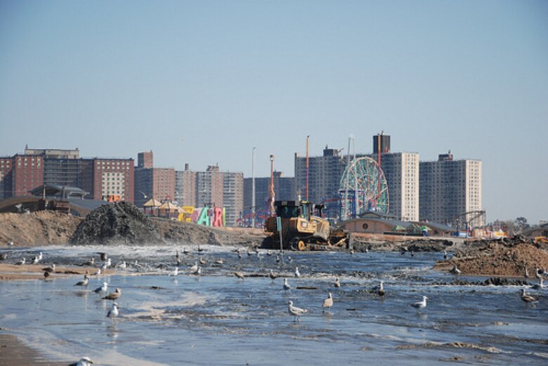 Coney Island landmarks are visible as crews work to place sand and restore the beach at Coney Island Friday September 20, 2013. The U.S. Army Corps of Engineers is placing roughly 600,000 cubic yards of sand at Coney Island to replace sand lost during Hurricane Sandy and also to restore the Coney Island project to its original design profile from when the coastal storm risk reduction project (primarily the beach) was originally constructed in the 1990s. While the beach is a tremendous recreational asset, it's important to note that the engineered beach is designed to act as a buffer and reduce risks to the community from coastal storms like Hurricane Sandy. 