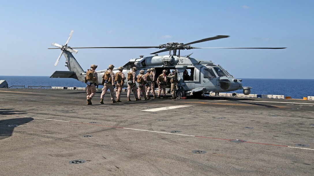 U.S. Marines with Battalion Landing Team 1/4 (BLT), 13th Marine Expeditionary Unit (MEU) conduct fast rope training aboard USS Boxer (LHD 4) Oct. 27, 2013. 13th MEU is deployed with the Boxer Amphibious Ready Group as a theater reserve and crisis response force throughout the U.S. 5th Fleet area of responsibility.(U.S. Marine Corps photo by Lance Cpl. Lonzo-Grei D. Thornton, 13th Marine Expeditionary Unit Combat Camera/Released)