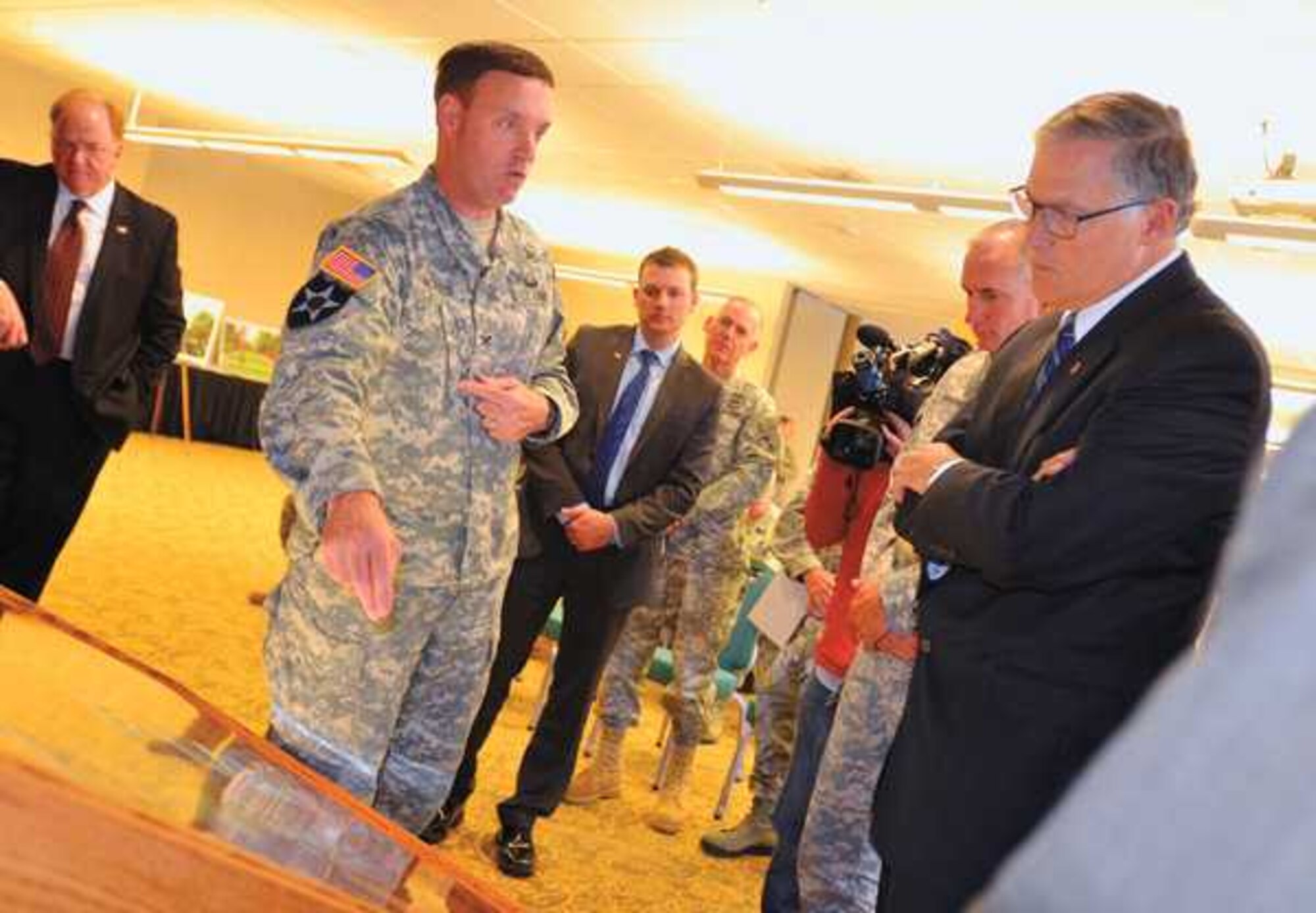 Col. H. Charles Hodges Jr. describes to Washington state Gov. Jay Inslee the Joint Base Lewis-McChord master plan for addressing traffic concerns. (U.S. Army photo by Julie Smith)