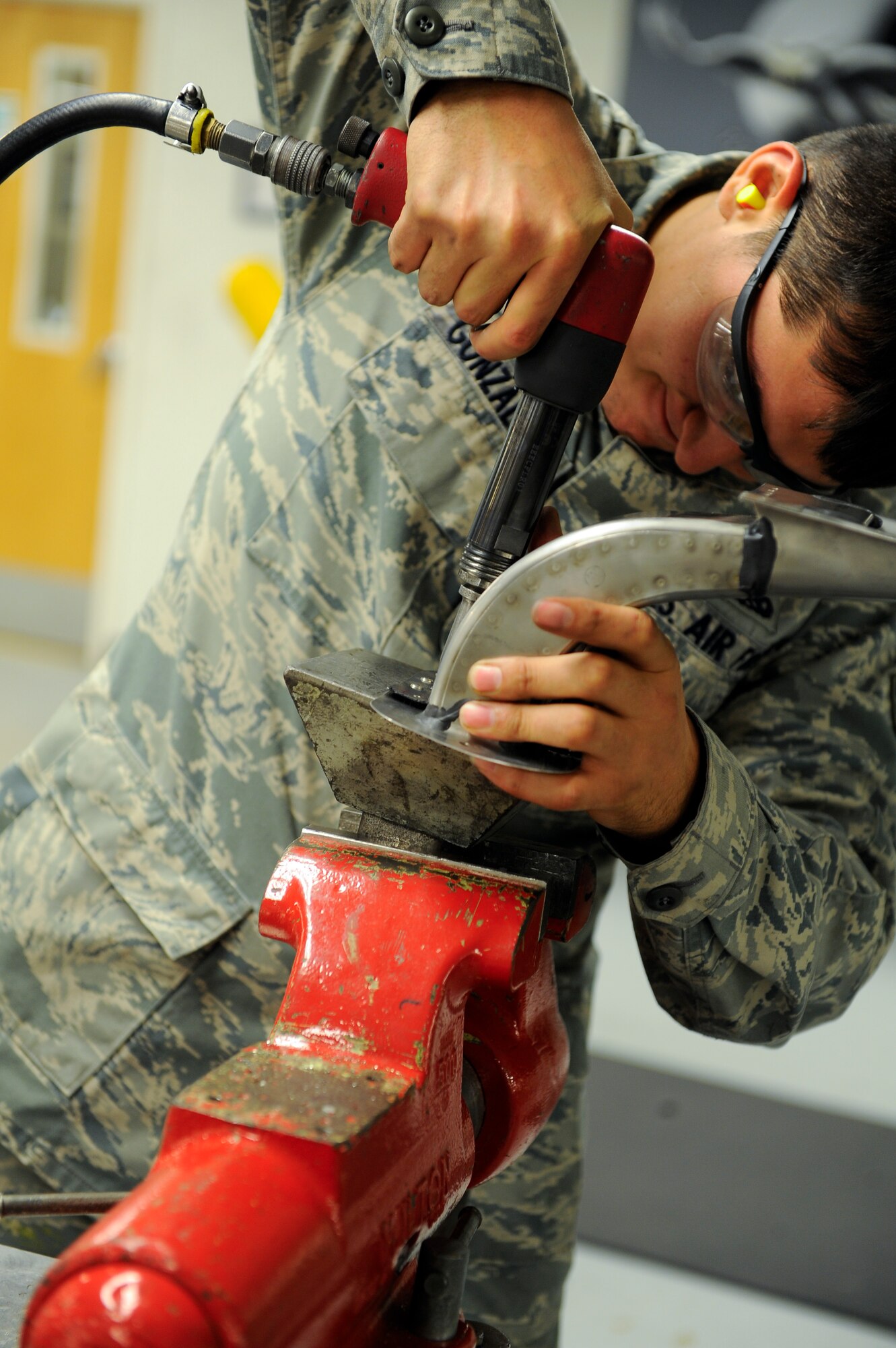 Senior Airman Sergio Gonzalez, 1st Special Operations Equipment Maintenance Squadron sheet metal journeyman, works on a new aft naucelle for the infrared system of an AC-130U Spooky Gunship at Hurlburt Field, Fla., Oct. 24, 2013. The heat from the Gunship’s engine can cause the metal to crack, which requires replacement. (U.S. Air Force photo/Airman 1st Class Jeff Parkinson)