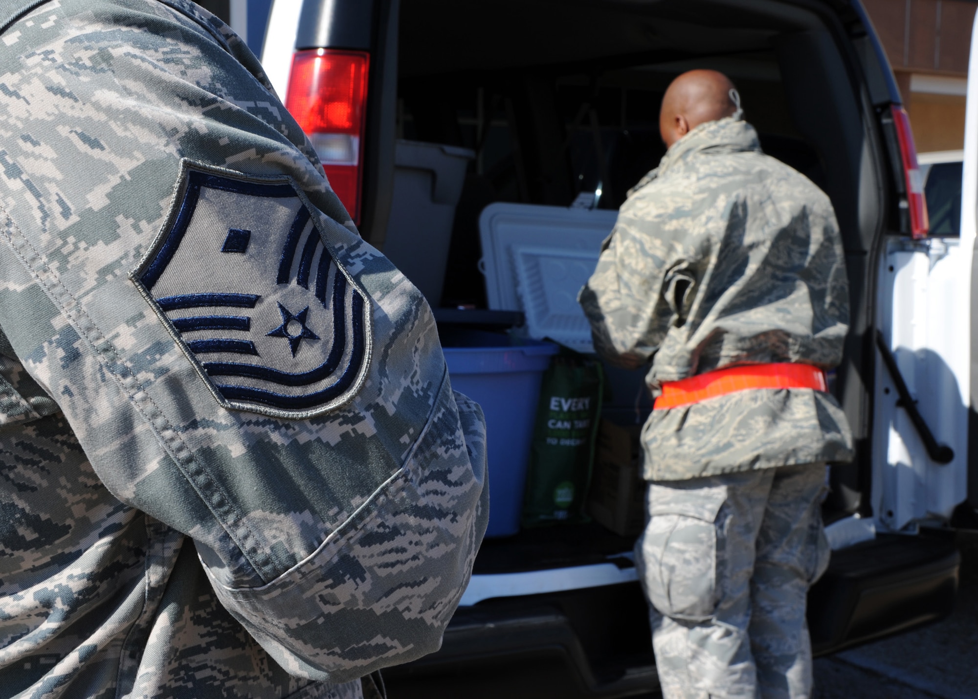 Base first sergeants deliver food to Airmen during an inspection on Barksdale Air Force Base, La., Oct. 25, 2013. To boost morale, the first sergeants, along with on-and off-base organizations, provided cookies, drinks and more than 160 hotdogs to Airmen who were working extended hours. (U.S. Air Force photo/Senior Airman Joseph A. Pagán Jr.)