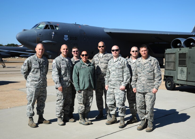 Base first sergeants pose for a group photo in front of a B-52H Stratofortress on Barksdale Air Force Base, La., Oct. 25, 2013. To help boost morale during a 12-hour shift, first sergeants drove around base delivering food and drinks to Airmen.(U.S. Air Force photo/Senior Airman Joseph A. Pagán Jr.)