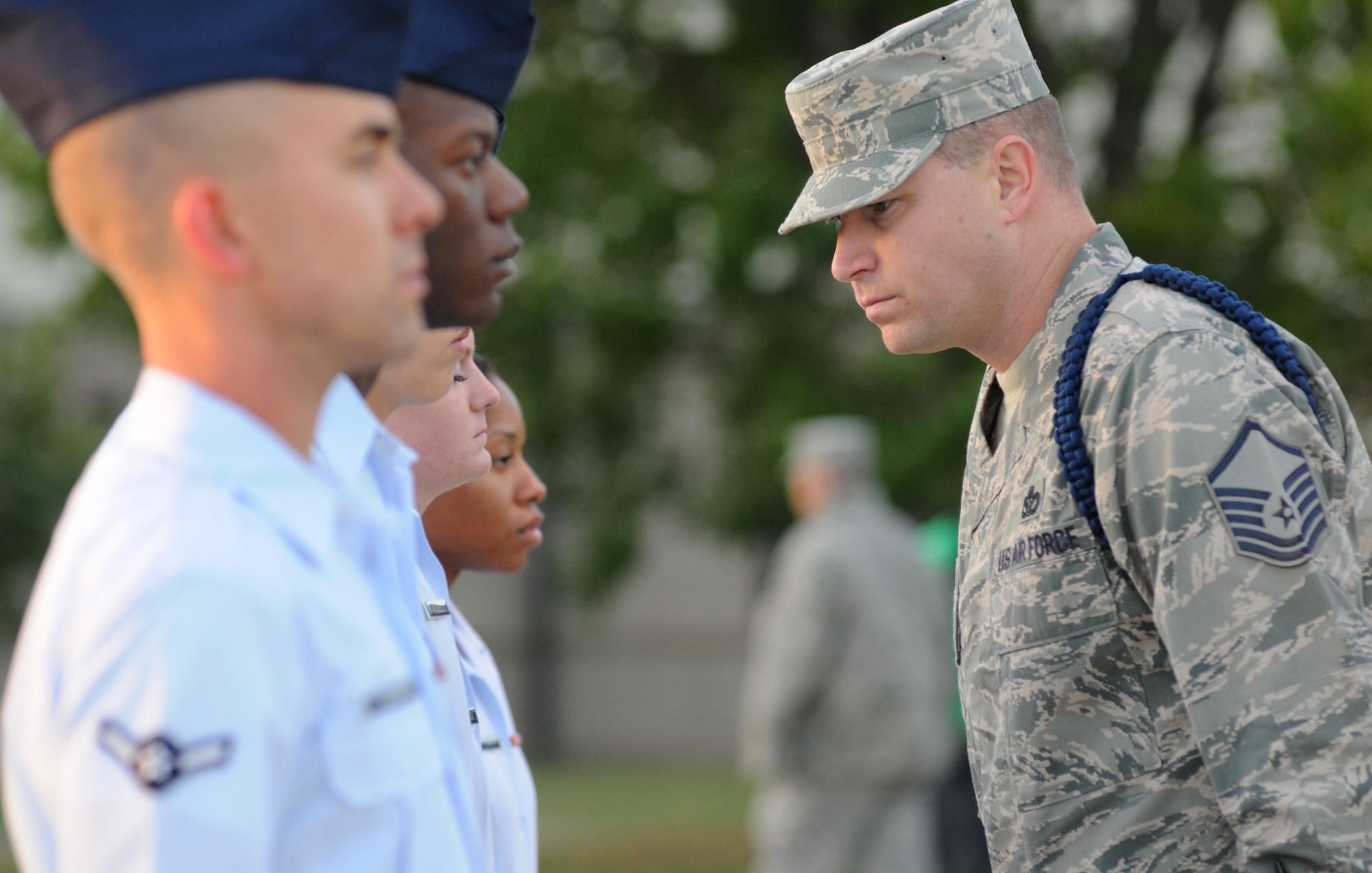 Master Sgt. Jedadiah Moss, 81st Training Group military training leader, inspects 335th Training Squadron drill team members during the open ranks portion of the 81st Training Group drill down competition Oct. 25, 2013, at the Levitow Training Support Facility, Keesler Air Force Base, Miss.  The 335th TRS took first place in freestyle and second place in open ranks, regulation and overall.  (U.S. Air Force photo by Kemberly Groue)