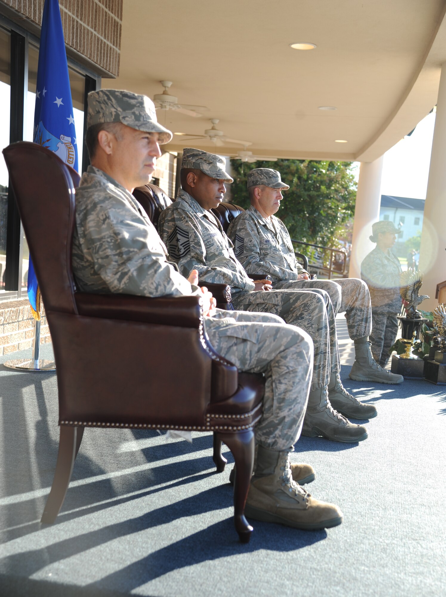 Col. George Tombe, 81st Training Group commander; Chief Master Sgts. Farrell Thomas, 81st Training Wing command chief, and Robert Winters, 81st TRG superintendent, watch the 81st Training Group drill down competition from the reviewing stage Oct. 25, 2013, at the Levitow Training Support Facility, Keesler Air Force Base, Miss.  Thomas was the reviewing official for the event.  (U.S. Air Force photo by Kemberly Groue)