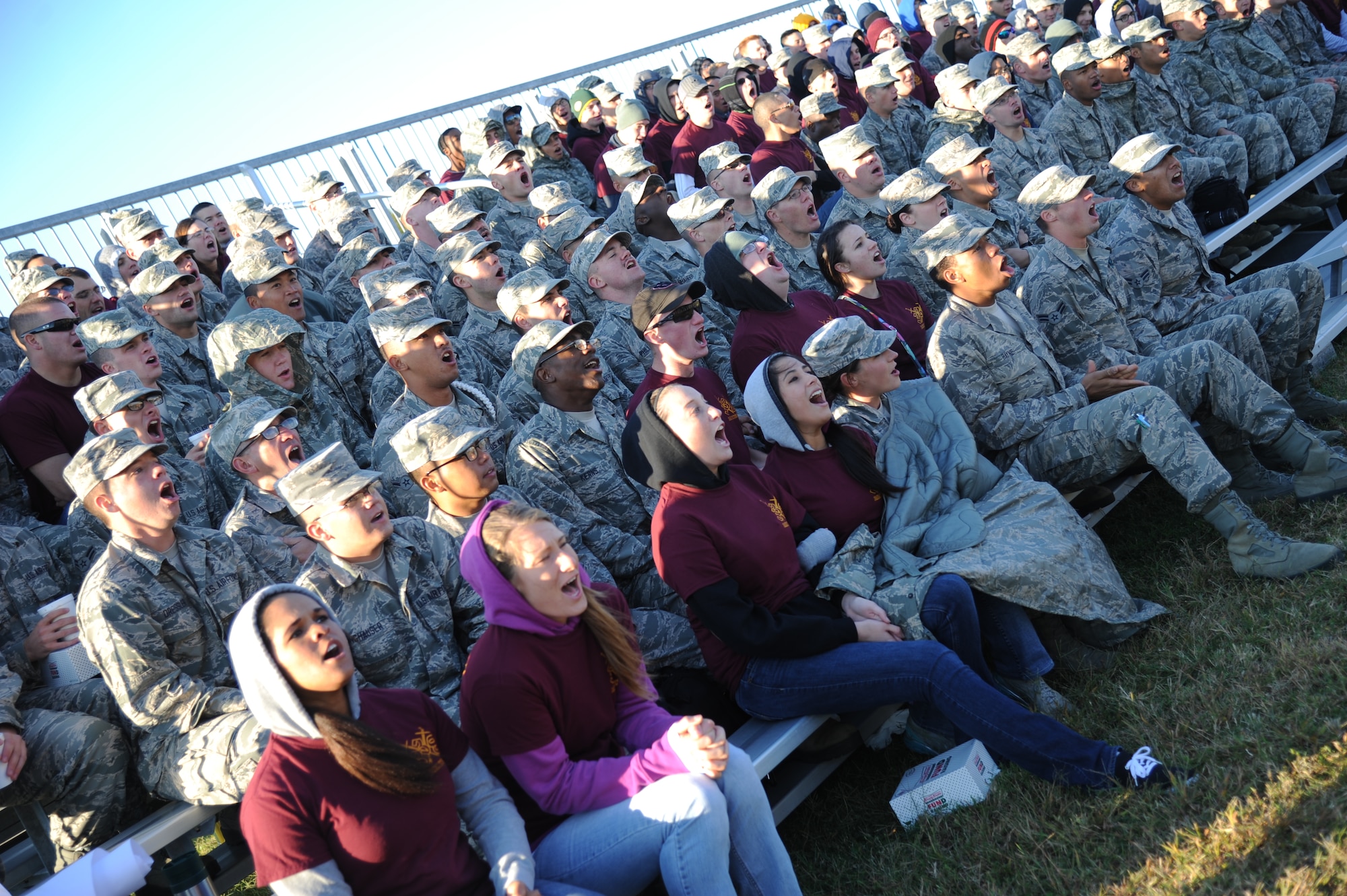 Airmen in the 338th Training Squadron yell their squadron chant at the beginning of the 81st Training Group drill down competition Oct. 25, 2013, at the Levitow Training Support Facility, Keesler Air Force Base, Miss.  The 338th TRS was the overall winner of the drill down and placed first in the open ranks and regulation competition.  (U.S. Air Force photo by Kemberly Groue)