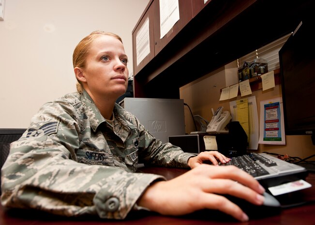 Staff Sgt. Kelly Sifers, 57th Aircraft Maintenance Squadron weapons team chief, enters data into the Core Automated Maintenance System at the Viper aircraft maintenance unit Oct. 22, 2013, at Nellis Air Force Base, Nev. Sifers was presented the Diamond Sharp award for September for her exceptional job performance and her volunteer work in the community, including volunteering at a local dog rescue and holding the American flag during the National Anthem at a University of Nevada Las Vegas football game. (U.S. Air Force photo by Airman 1st Class Thomas Spangler)